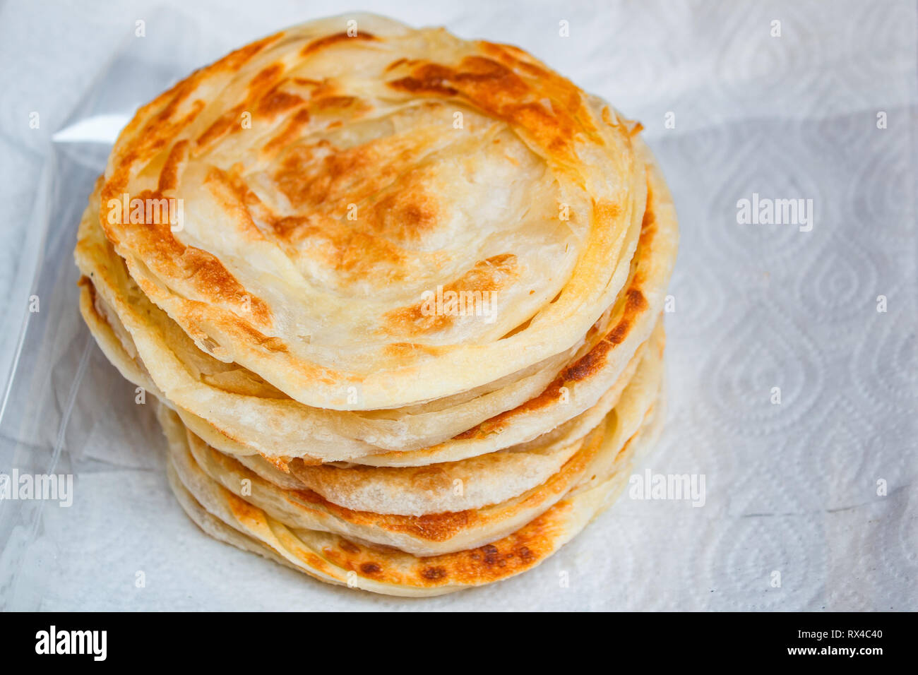 Stack of fried crispy roti at street food, thai style Stock Photo - Alamy