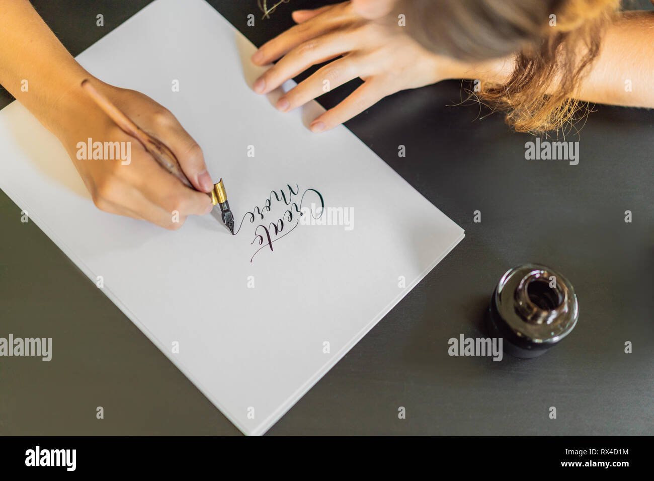 Calligrapher Hands Writes Phrase On White Paper Phrase Create