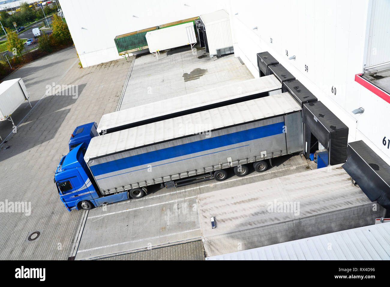 Loading bay and trucks hi-res stock photography and images - Alamy