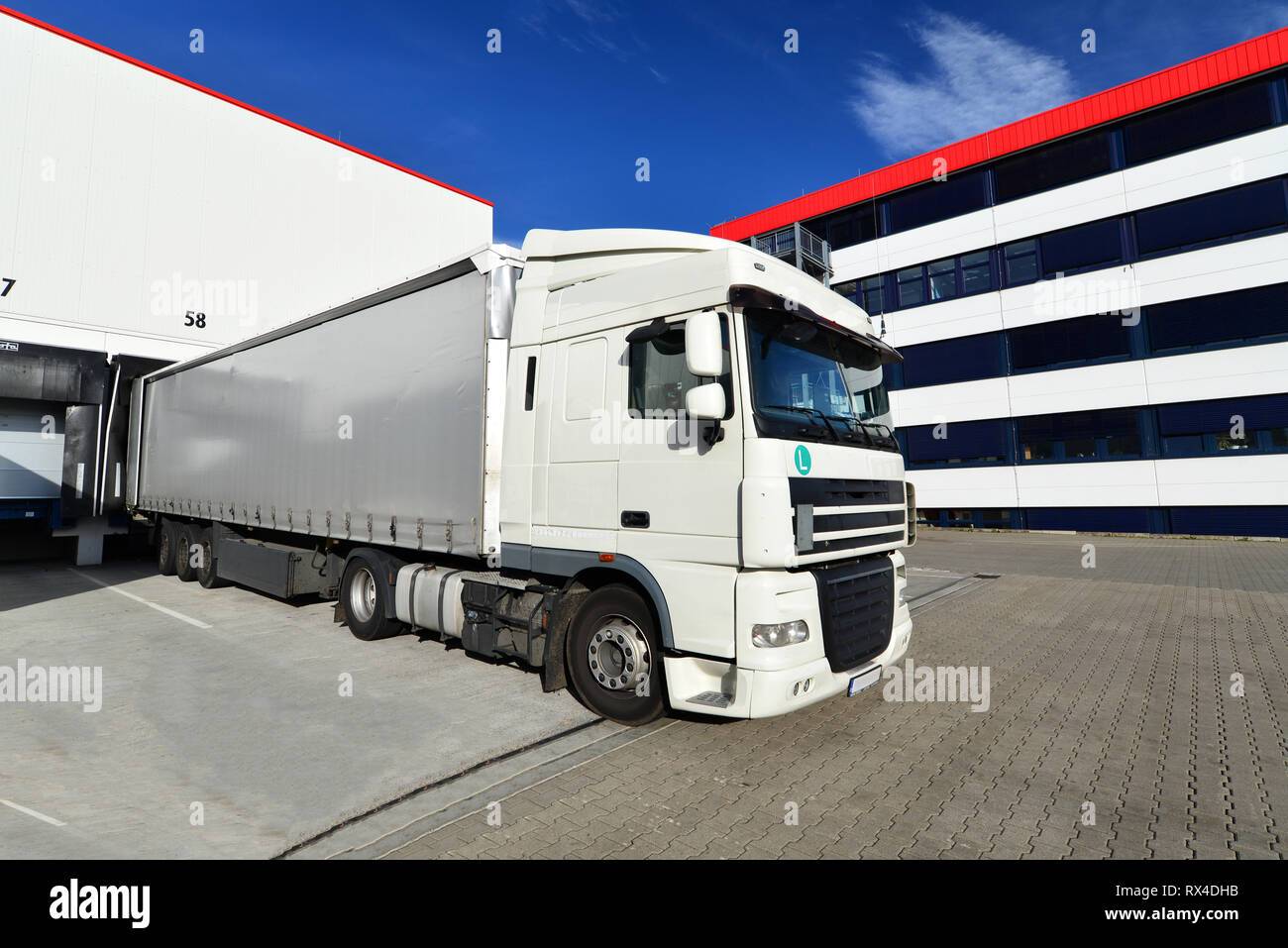 logistics and goods storage - loading and unloading of goods for transport by truck Stock Photo