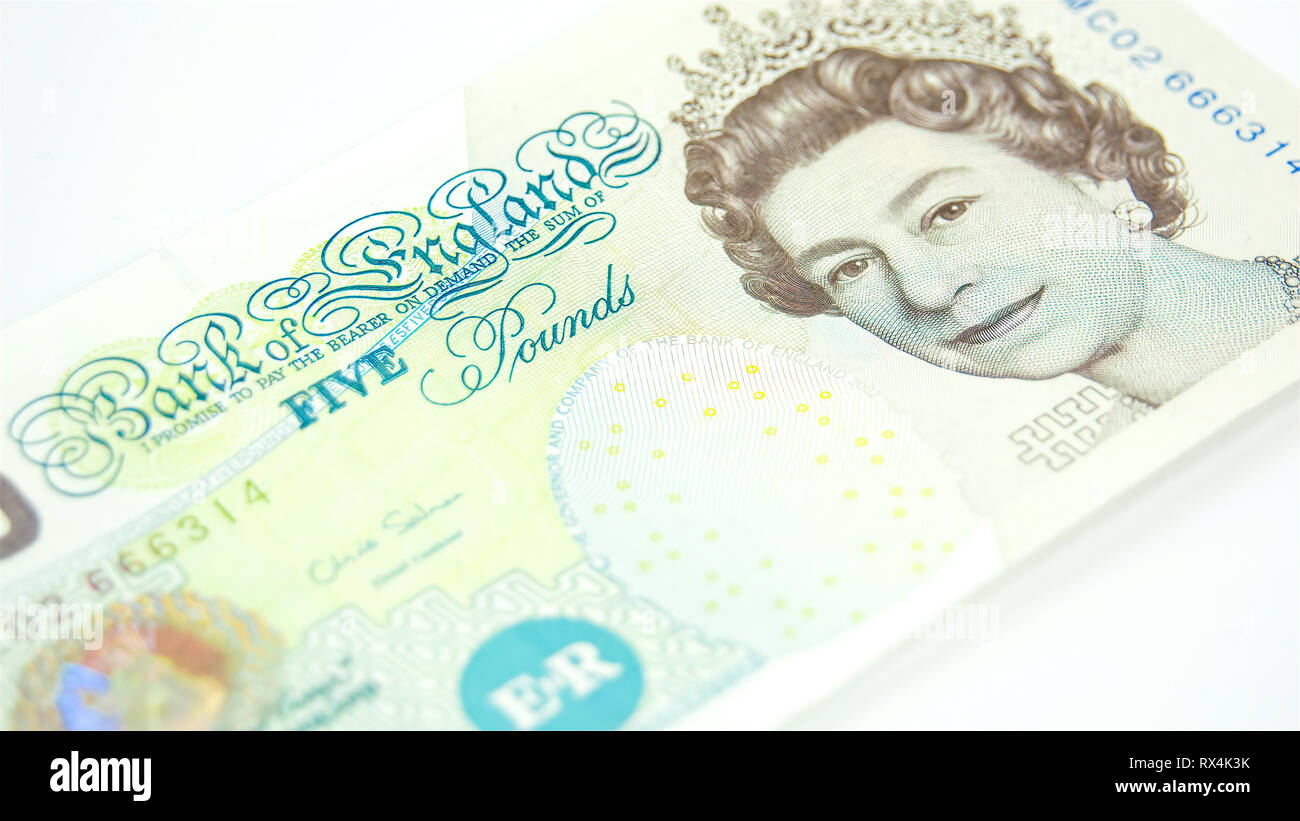 Rotating view of the 5 Pounds bill in England. The pound is a unit of currency in some nations. The term originated in Great Britain as the value of a Stock Photo