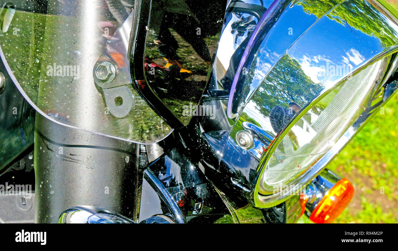 The headlight of the big bike on parking. The silver color of the motor bike that is parked on the parking lot Stock Photo Alamy