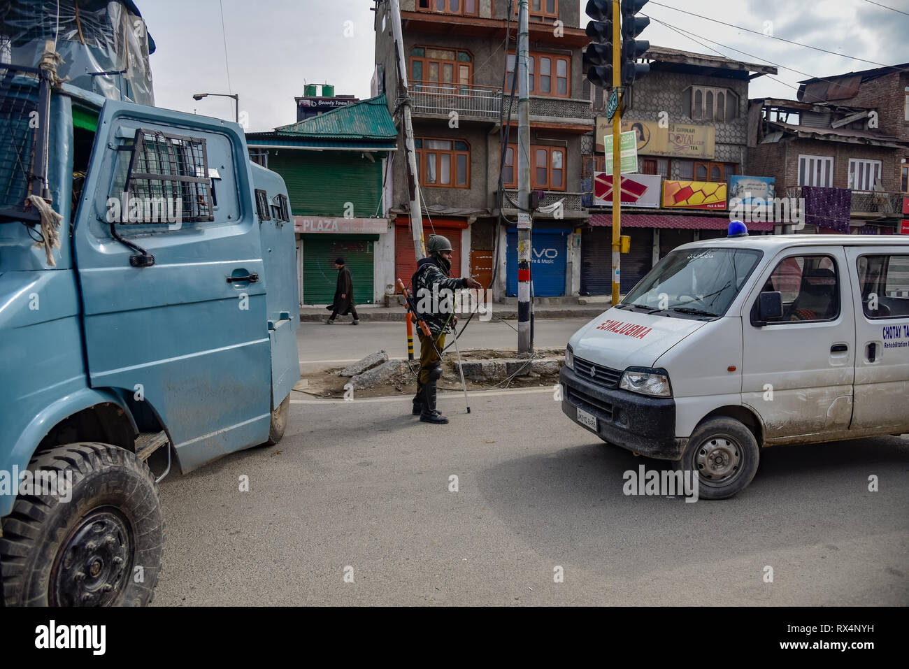 Indian paramilitary trooper seen stopping an ambulance during restrictions in down town area of  Srinagar. Authorities imposed restrictions in parts of Srinagar Kashmir to prevent protest called by Joint Resistance Leadership (JRL) against the detention of Jammu and Kashmir Liberation front chairman Yasin Malik and the arrest of Jamaat-e-Islamia cadres. Stock Photo