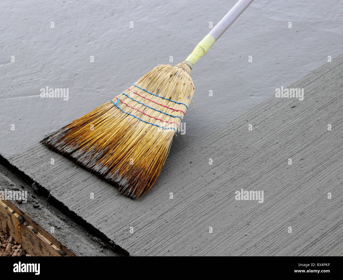 Brushing fresh concrete Stock Photo Alamy
