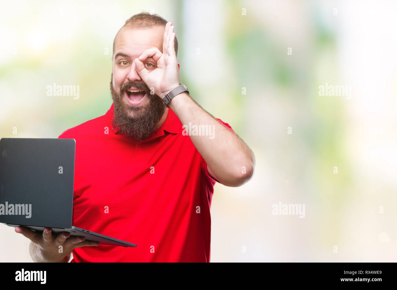 Young caucasian man using computer laptop over isolated background with ...