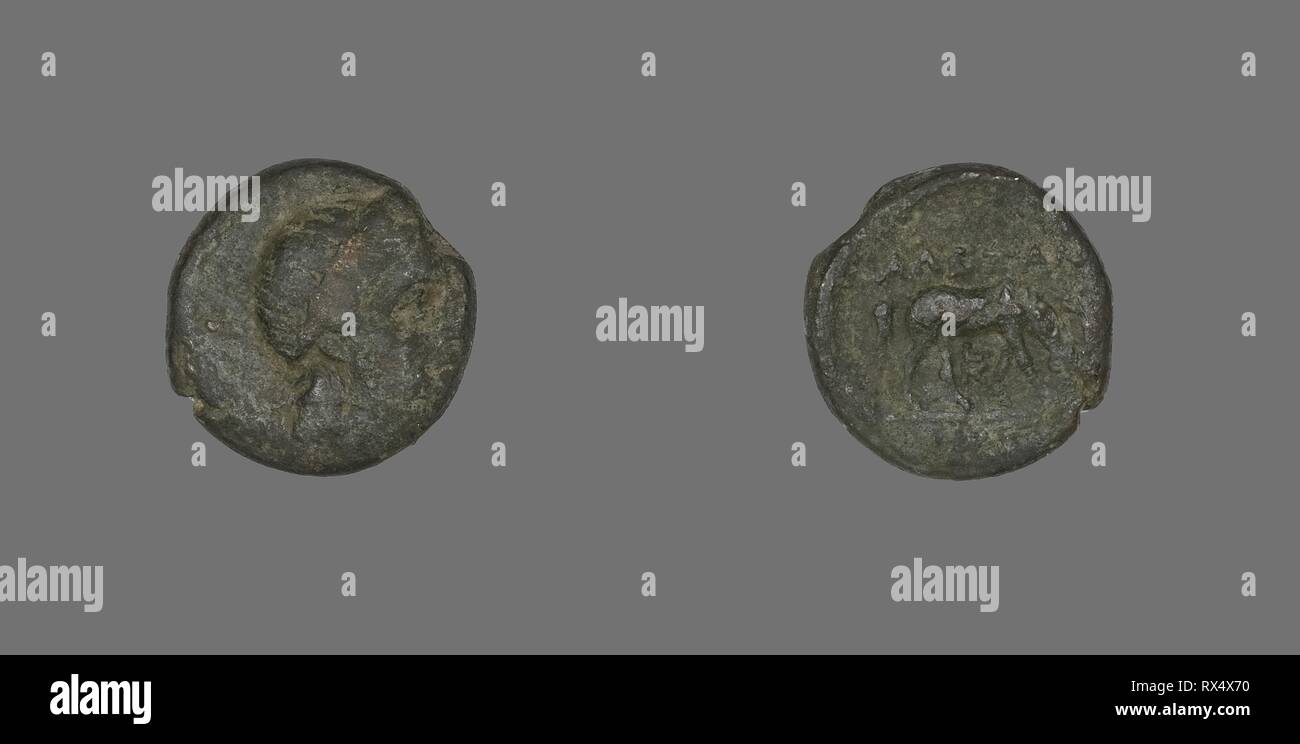Coin Depicting the God Apollo. Greek. Date: 300 BC. Dimensions: Diam. 1.5 cm; 3.68 g. Bronze. Origin: Ancient Greece. Museum: The Chicago Art Institute. Stock Photo