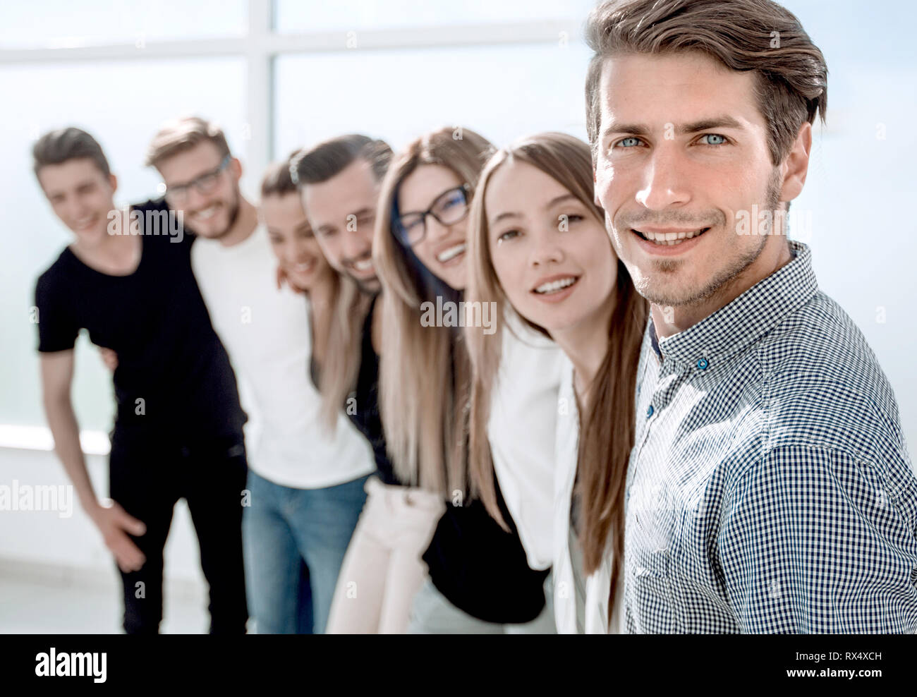 group of successful young people standing in the office Stock Photo - Alamy