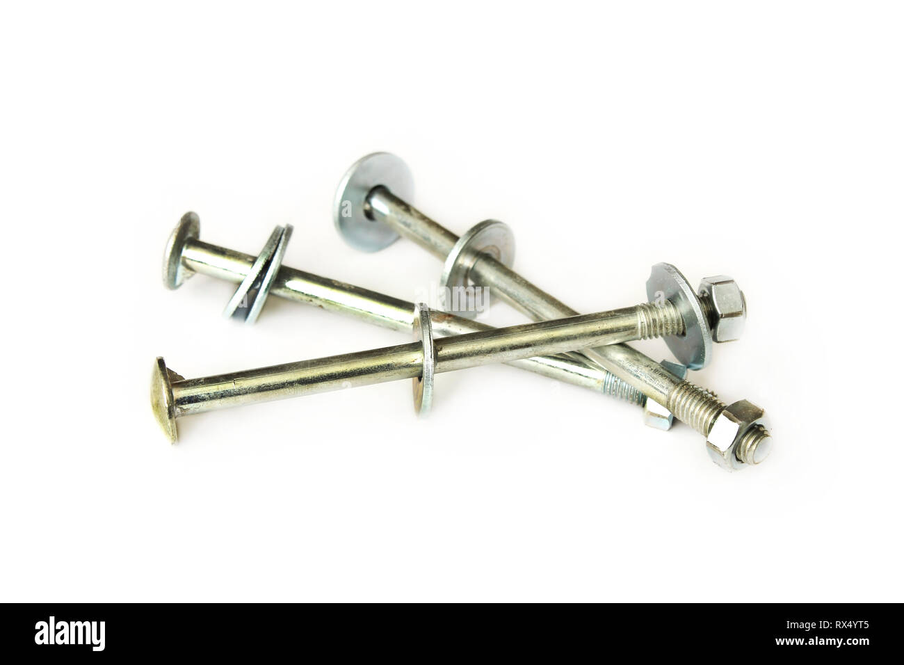 Furniture mounting bolts with nuts and washers isolated on white
