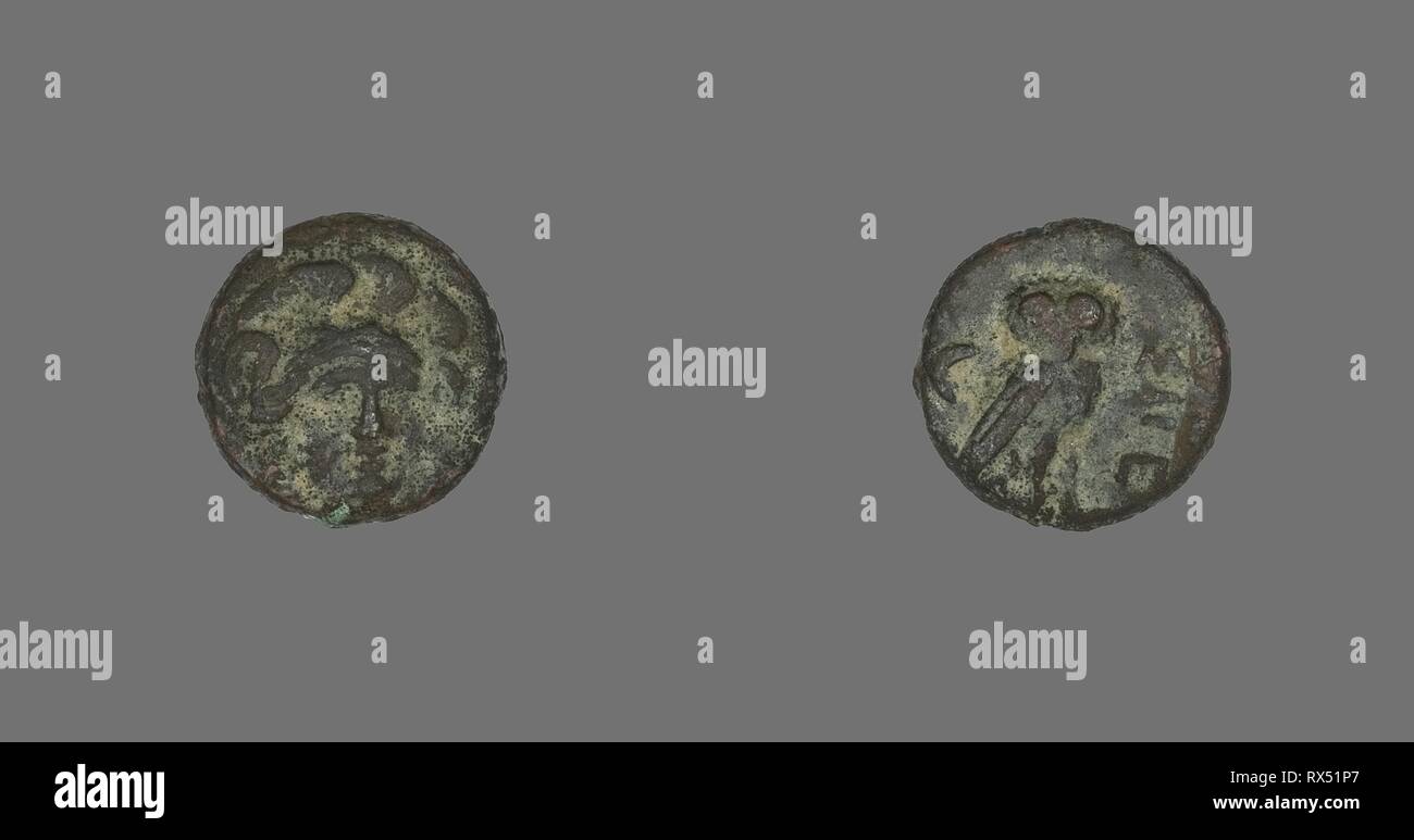 Coin Depicting the Goddess Athena. Greek. Date: 400 BC-301 BC. Dimensions: Diam. 1.2 cm; 1.94 g. Bronze. Origin: Ancient Greece. Museum: The Chicago Art Institute. Stock Photo