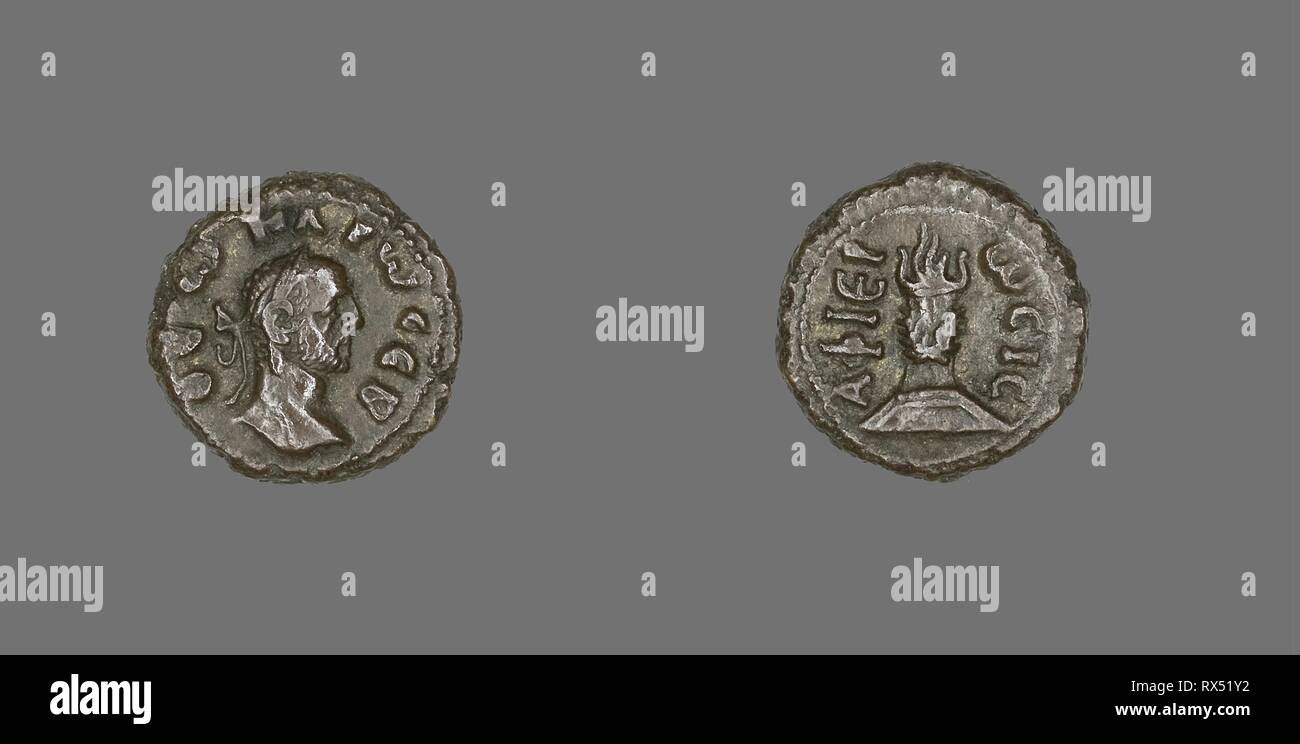 Coin Portraying Emperor Carus. Roman, minted in Alexandria, Egypt. Date: 282 AD-283 AD. Dimensions: Diam. 2 cm; 7.71 g. Billon. Origin: Roman Empire. Museum: The Chicago Art Institute. Author: ANCIENT ROMAN. Stock Photo