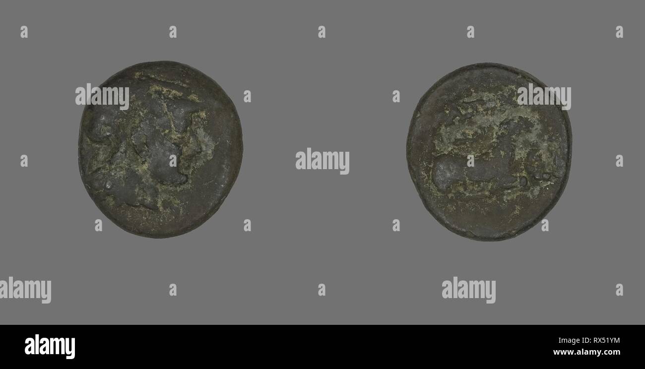 Coin Depicting the Goddess Athena. Greek. Date: 387 BC-301 BC. Dimensions: Diam. 1.7 cm; 3.94 g. Bronze. Origin: Ancient Greece. Museum: The Chicago Art Institute. Stock Photo
