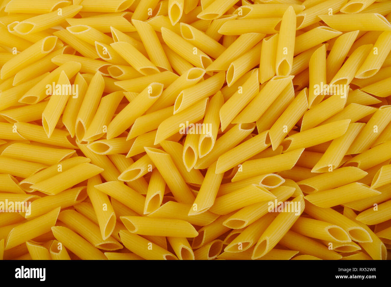 Penne pasta background Stock Photo - Alamy