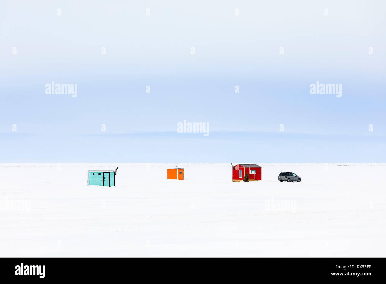 Colorful Ice fishing shacks on Lake Winnipeg, near Gimli, Manitoba, Canada. Stock Photo