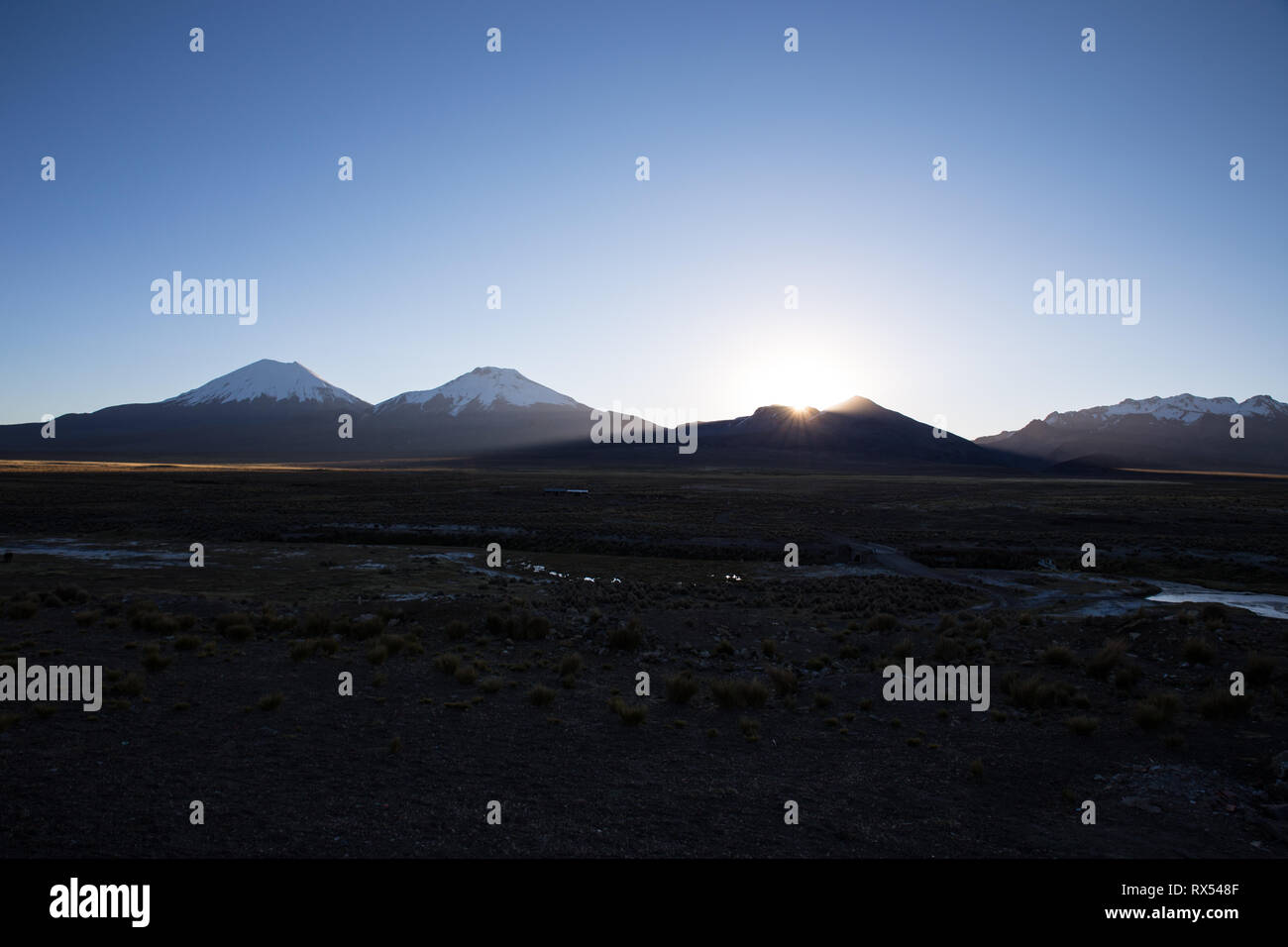 Sunset in Andes. Parinacota volcano. High Andean landscape in the Andes ...