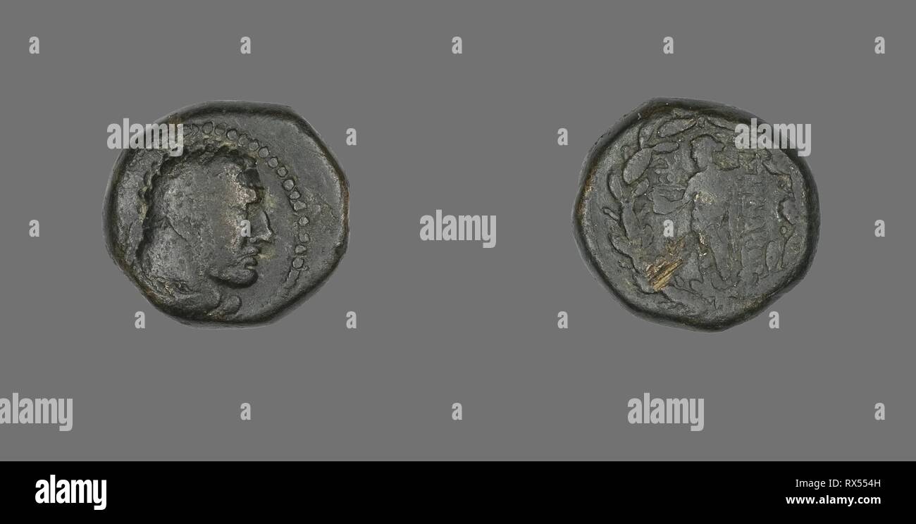 Coin Depicting the Hero Herakles. Greek. Date: 133 BC. Dimensions: Diam. 1.7 cm; 5.96 g. Bronze. Origin: Ancient Greece. Museum: The Chicago Art Institute. Stock Photo