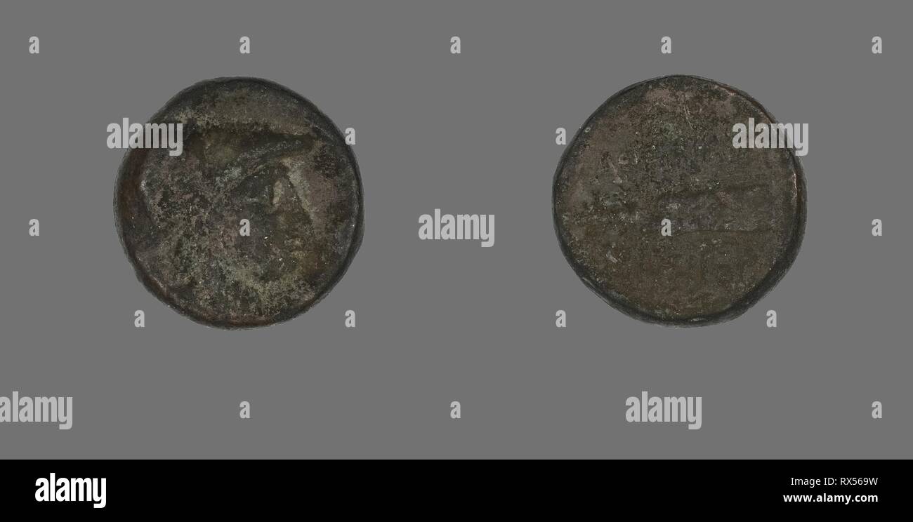 Coin Depicting the Goddess Athena. Greek. Date: 200 BC-133 BC. Dimensions: Diam. 1.7 cm; 6.07 g. Bronze. Origin: Ancient Greece. Museum: The Chicago Art Institute. Stock Photo