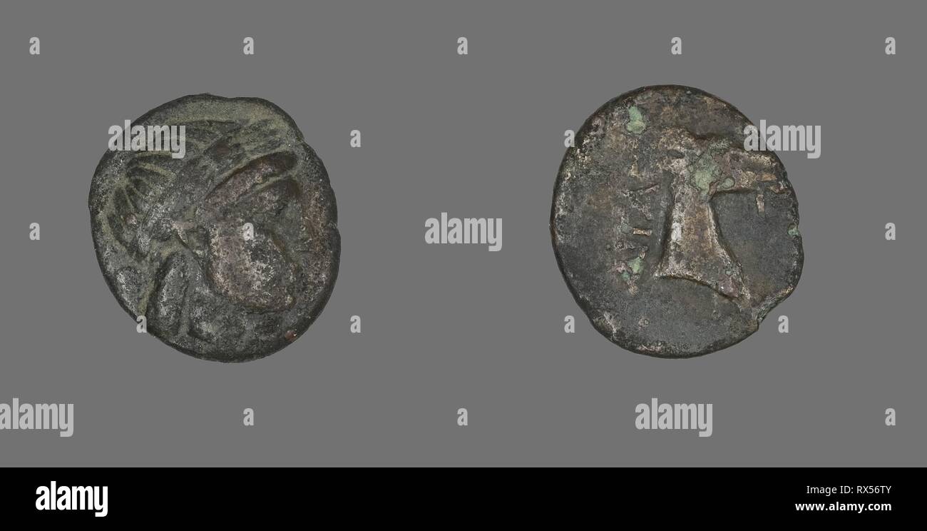 Coin Depicting the God Apollo. Greek. Date: 300 BC-201 BC. Dimensions: Diam. 1.8 cm; 3.12 g. Bronze. Origin: Ancient Greece. Museum: The Chicago Art Institute. Stock Photo