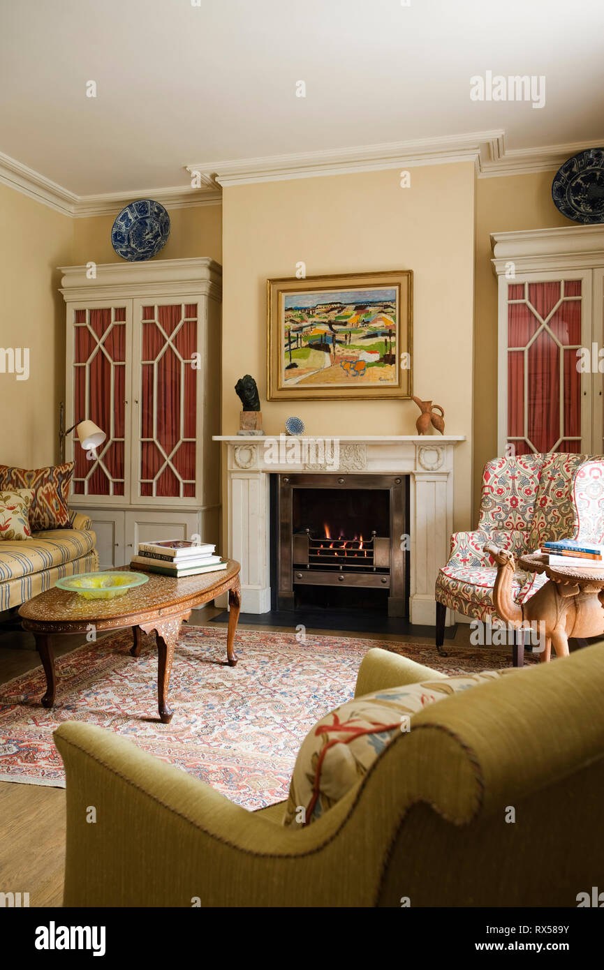 Country style living room with fireplace Stock Photo Alamy