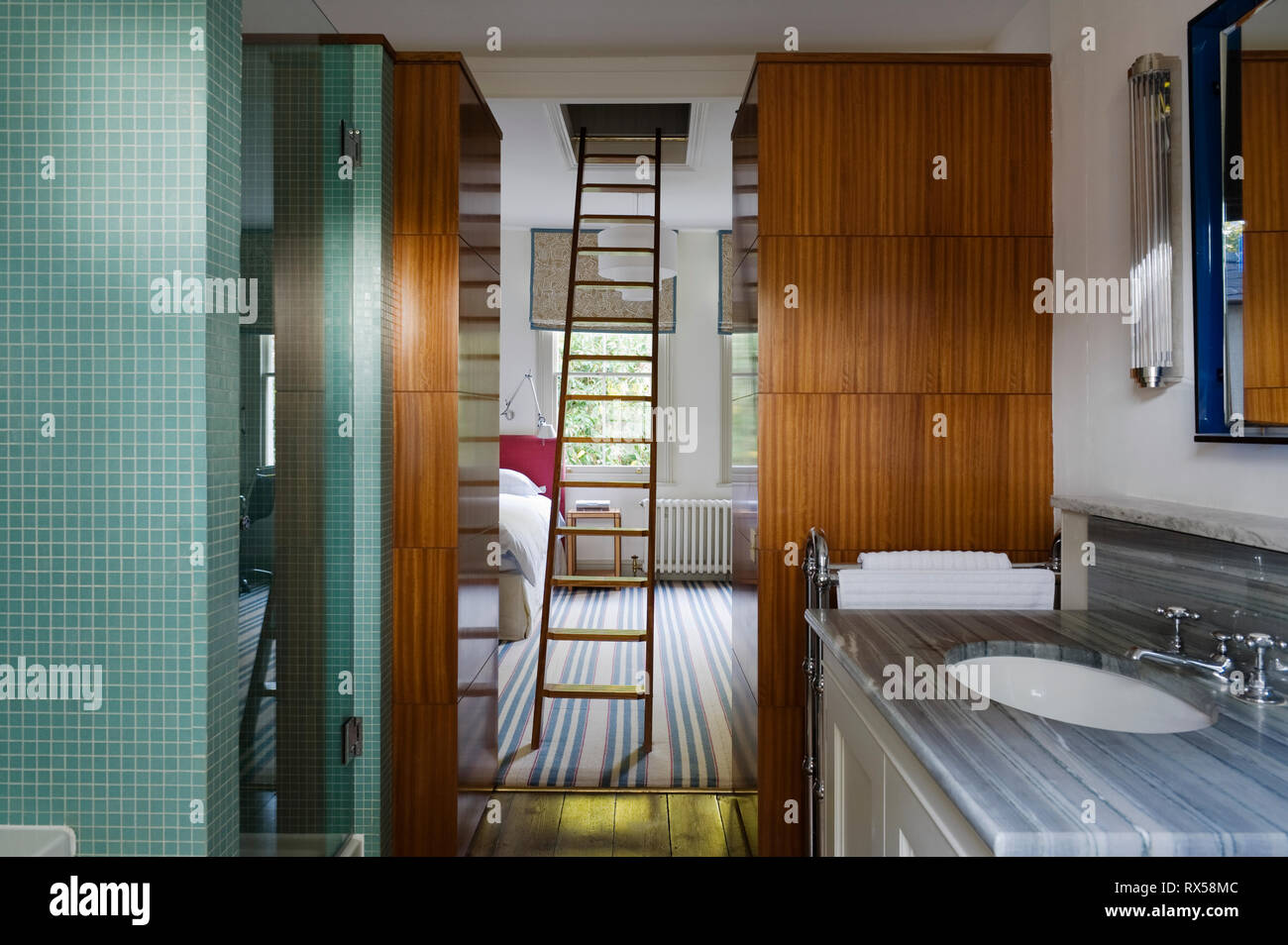 Ladder in bedroom with ensuite Stock Photo