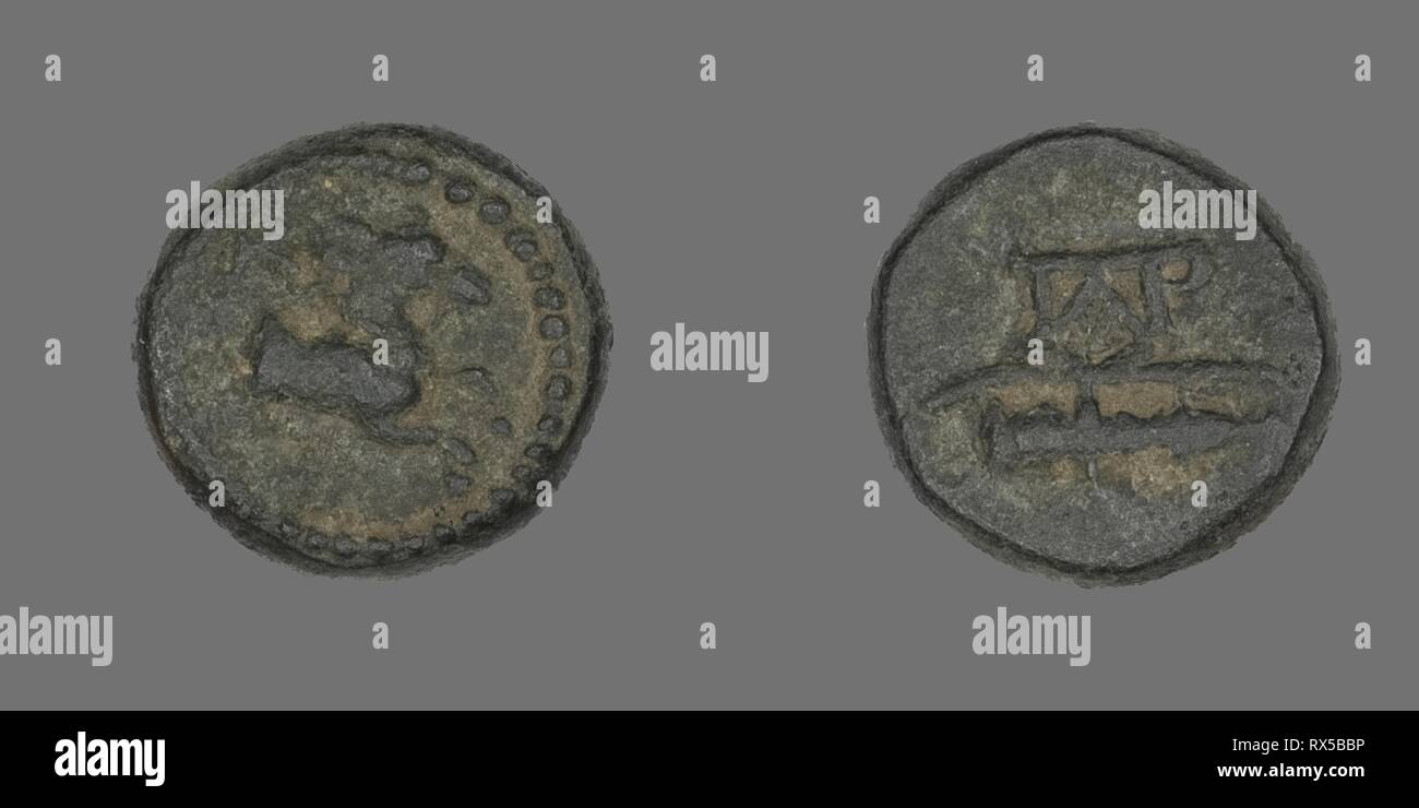 Coin Depicting a Horse. Greek. Date: 190 BC. Dimensions: Diam. 1.2 cm; 2.09 g. Bronze. Origin: Ancient Greece. Museum: The Chicago Art Institute. Stock Photo
