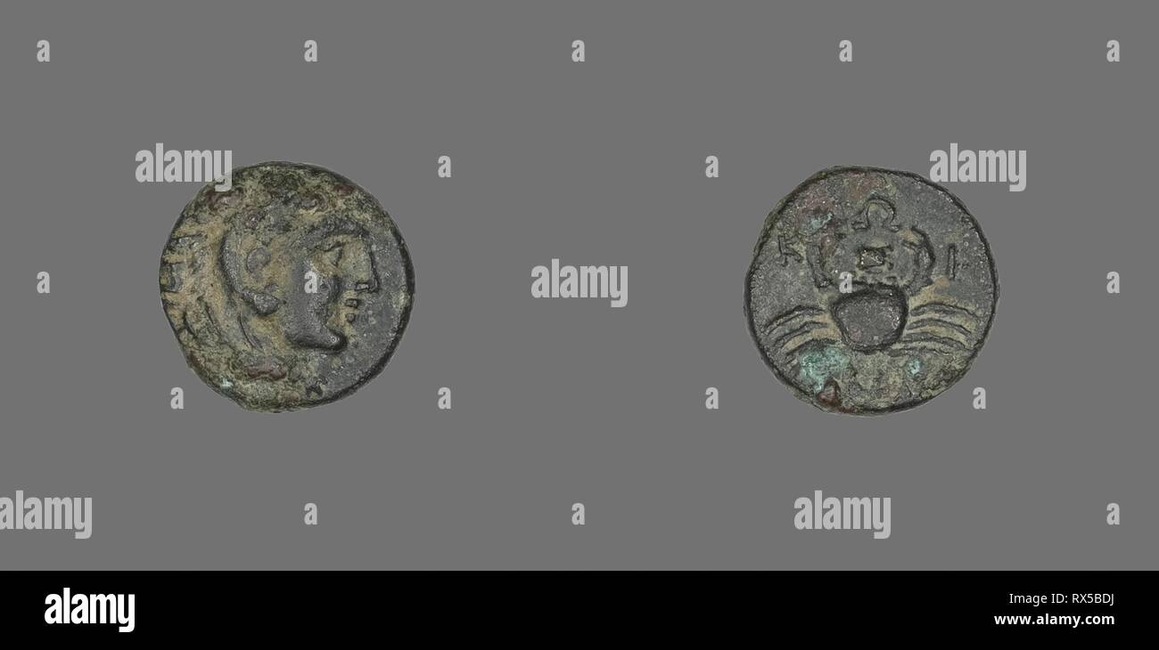 Coin Depicting the Hero Herakles. Greek. Date: 350 BC-300 BC. Dimensions: Diam. 1.2 cm; 1.57 g. Bronze. Origin: Ancient Greece. Museum: The Chicago Art Institute. Stock Photo