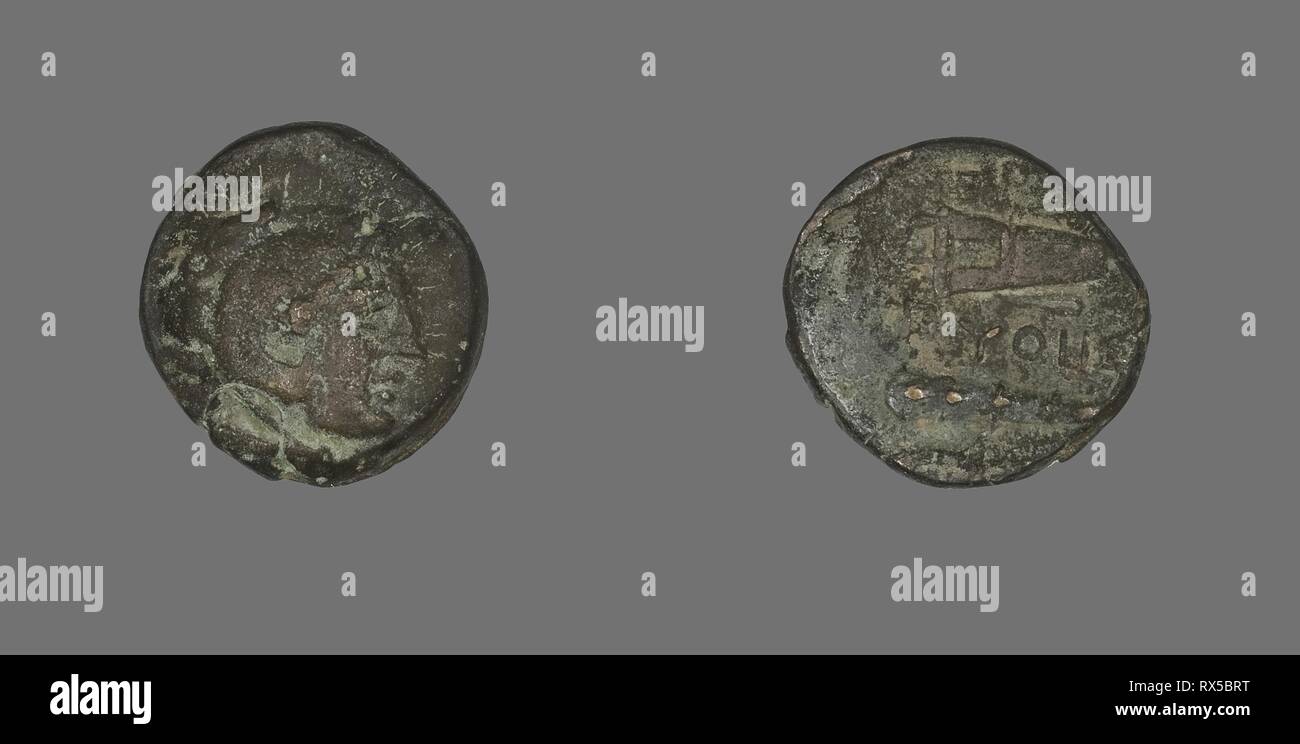 Coin Depicting the Hero Herakles. Greek. Date: 400 BC-301 BC. Dimensions: Diam. 1.7 cm; 3.92 g. Bronze. Origin: Ancient Greece. Museum: The Chicago Art Institute. Stock Photo
