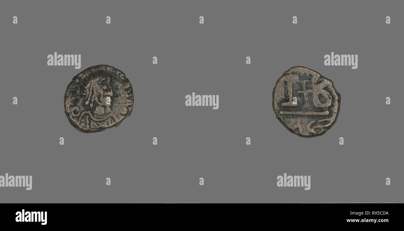 12 Nummi (Coin) of a Byzantine Emperor. Byzantine, minted in Alexandria. Date: 500 AD-599 AD. Dimensions: Diam. 1.5 cm; 2.64 g. Bronze. Origin: Byzantine Empire. Museum: The Chicago Art Institute. Stock Photo