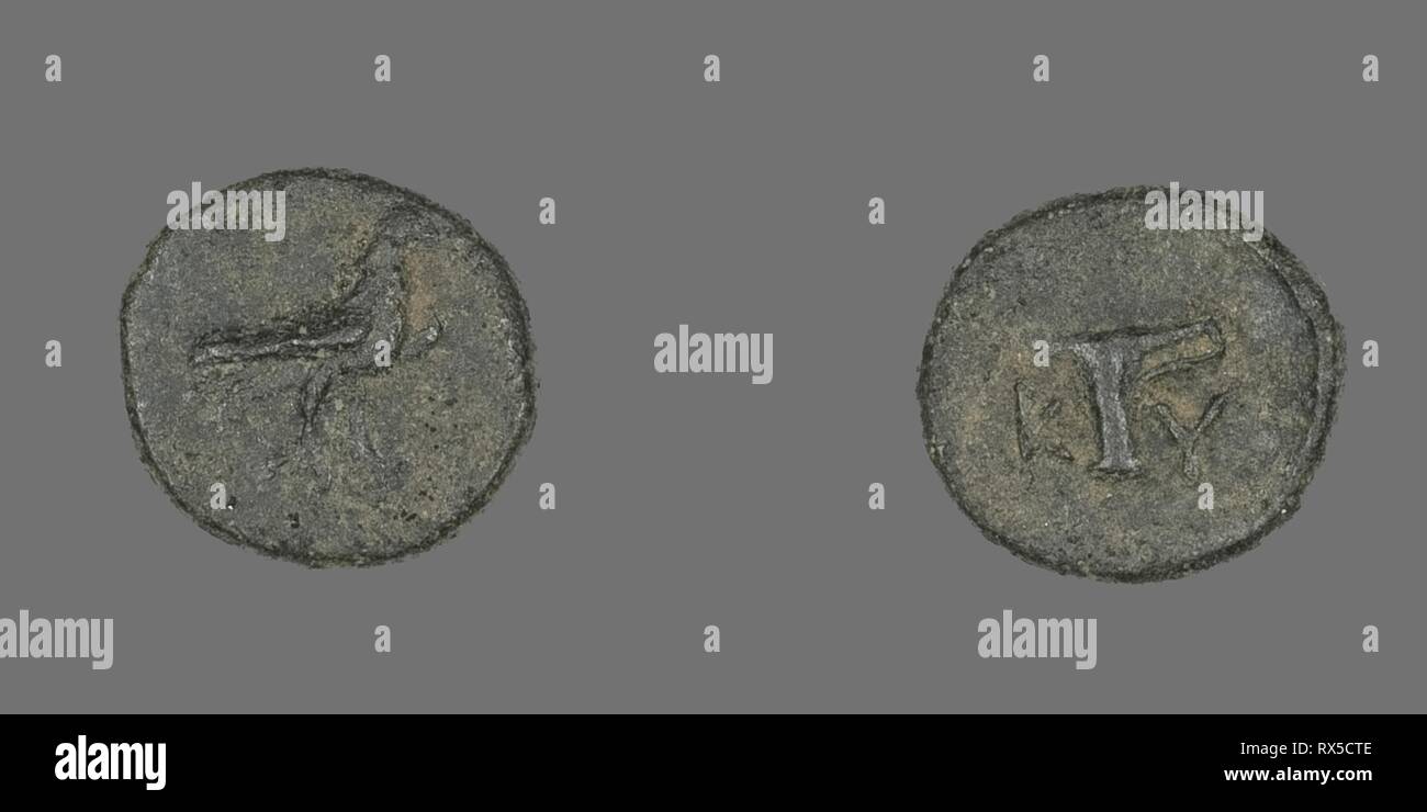 Coin Depicting an Eagle. Greek. Date: 320 BC-250 BC. Dimensions: DIam. 1.1 cm; 1.04 g. Bronze. Origin: Ancient Greece. Museum: The Chicago Art Institute. Stock Photo