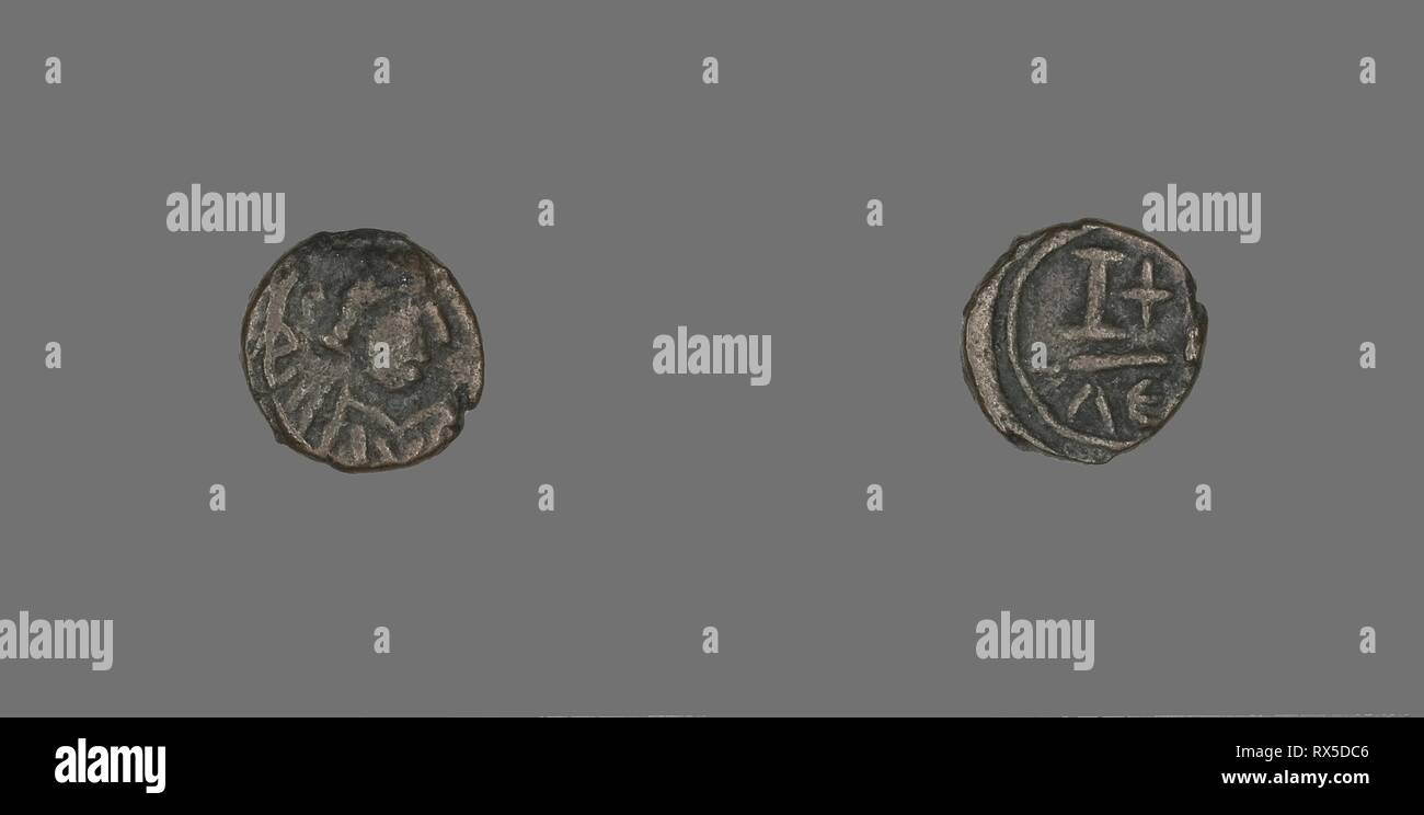 12 Nummi (Coin) of a Byzantine Emperor. Byzantine, minted in Alexandria. Date: 500 AD-599 AD. Dimensions: Diam. 1.4 cm; 2.52 g. Bronze. Origin: Byzantine Empire. Museum: The Chicago Art Institute. Stock Photo