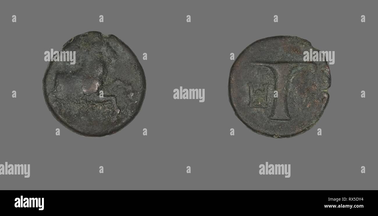 Coin Depicting a Horse. Greek. Date: 320 BC-250 BC. Dimensions: Diam. 1.8 cm; 4.13 g. Bronze. Origin: Ancient Greece. Museum: The Chicago Art Institute. Stock Photo
