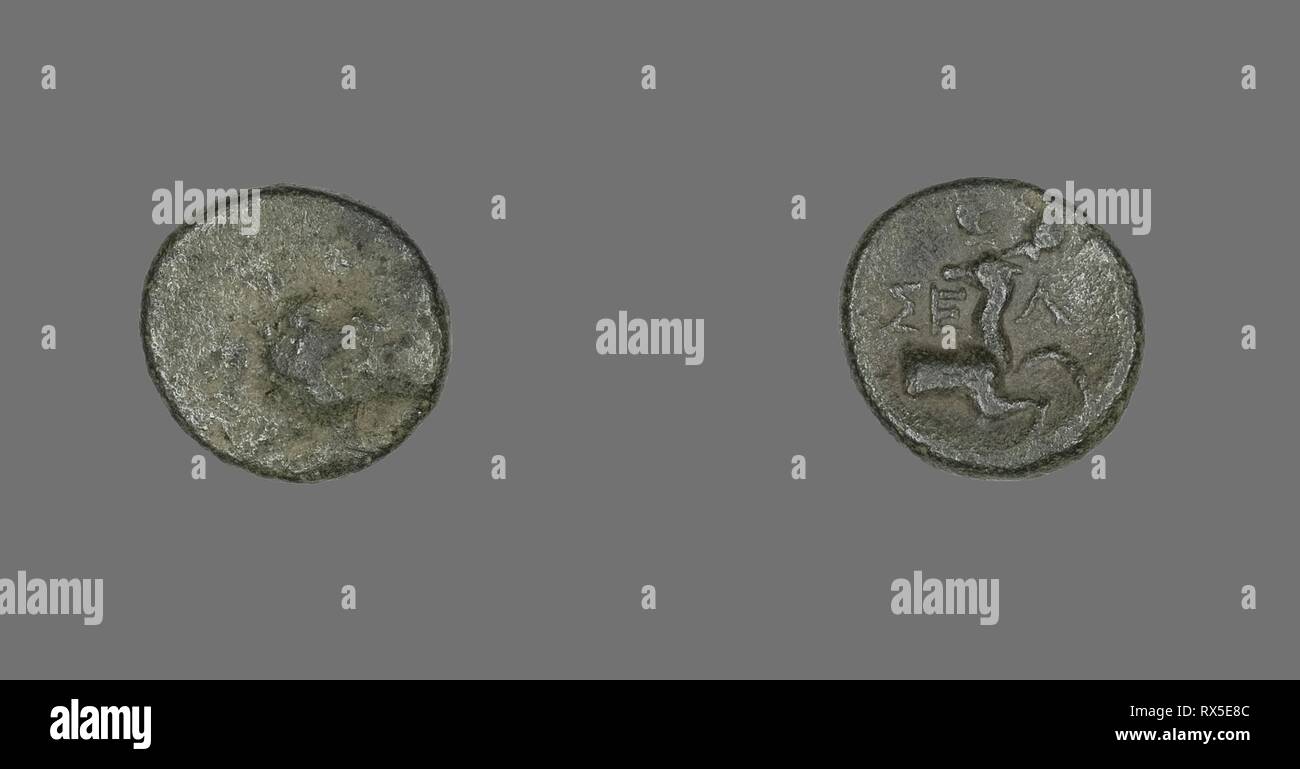 Coin Depicting the Hero Herakles. Greek. Date: 200 BC-1 BC. Dimensions: Diam. 1.3 cm; 1.68 g. Bronze. Origin: Ancient Greece. Museum: The Chicago Art Institute. Stock Photo