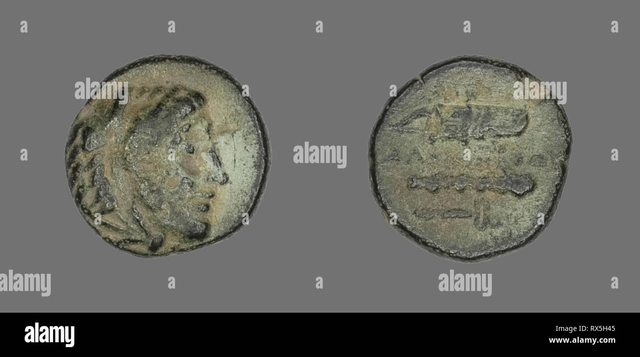 Coin Depicting the Hero Herakles. Greek. Date: 336 BC-323 BC. Dimensions: Diam. 1.1 cm; 1.42 g. Bronze. Origin: Ancient Greece. Museum: The Chicago Art Institute. Stock Photo