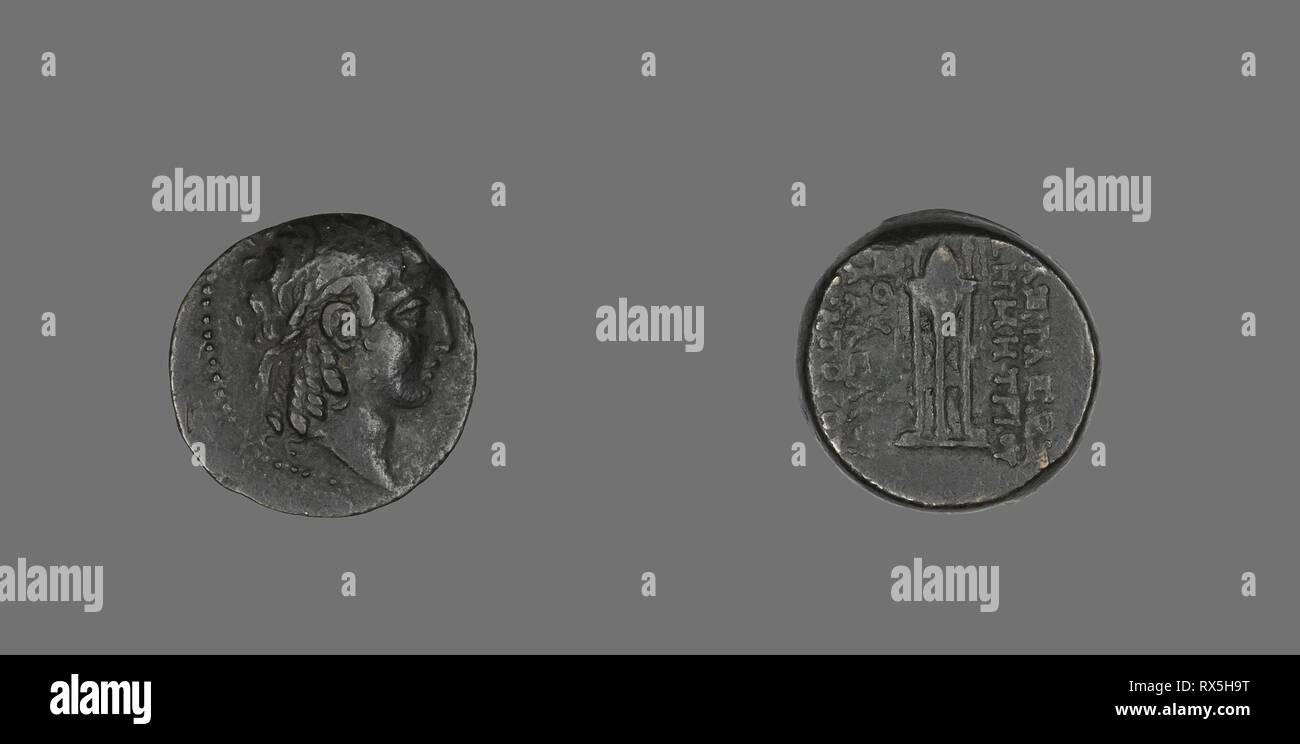Coin Depicting the God Apollo. Greek. Date: 146 BC-139 BC. Dimensions: Diam. 1.9 cm; 5.57 g. Bronze. Origin: Ancient Greece. Museum: The Chicago Art Institute. Stock Photo