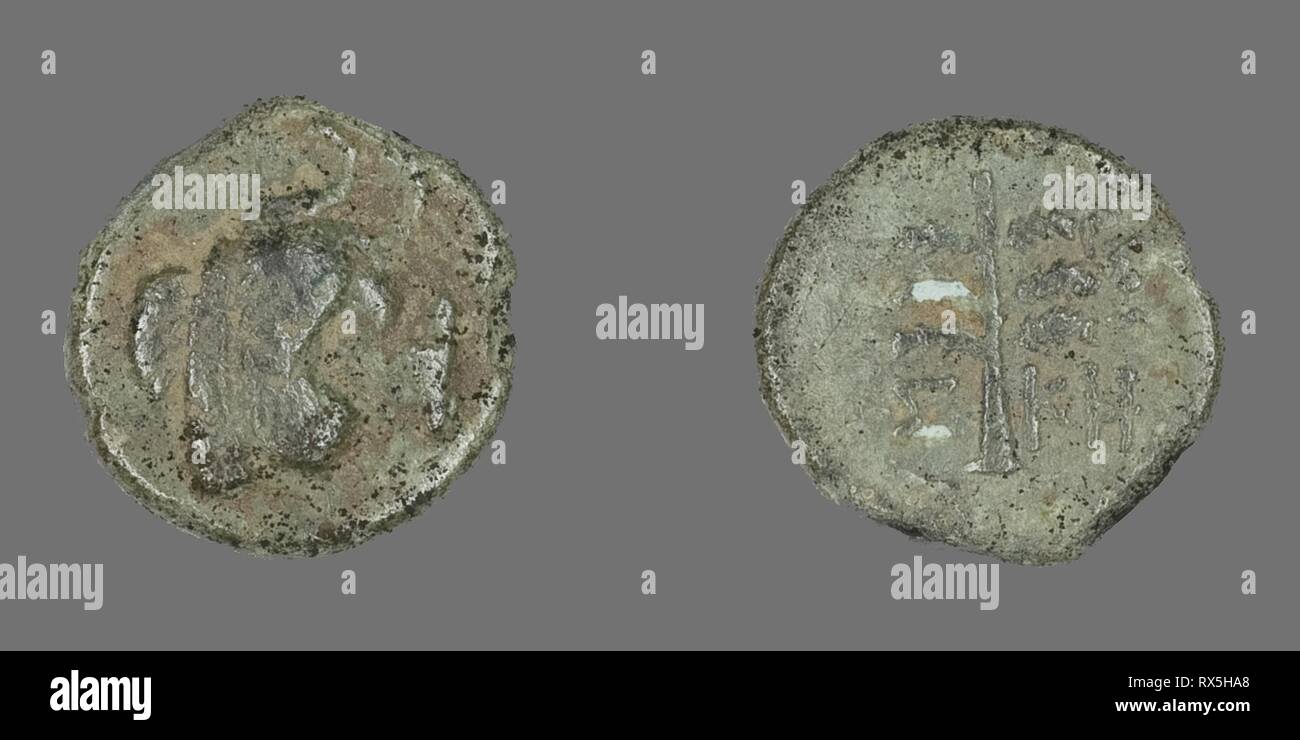 Coin Depicting Pegasus. Greek. Date: 400 BC-301 BC. Dimensions: Diam. 1.4 cm; 1.41 g. Bronze. Origin: Ancient Greece. Museum: The Chicago Art Institute. Stock Photo