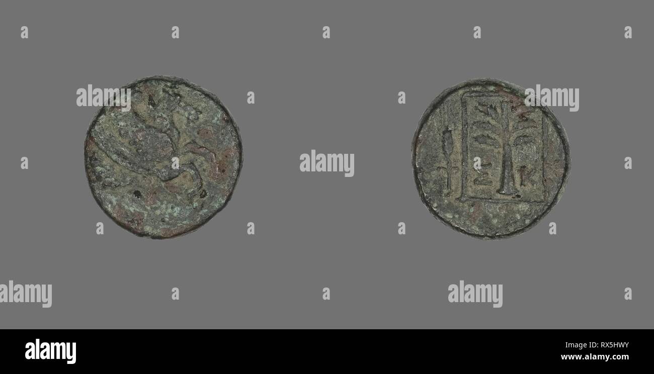 Coin Depicting Pegasus. Greek. Date: 400 BC-301 BC. Dimensions: Diam. 1.6 cm; 4.11 g. Bronze. Origin: Ancient Greece. Museum: The Chicago Art Institute. Stock Photo