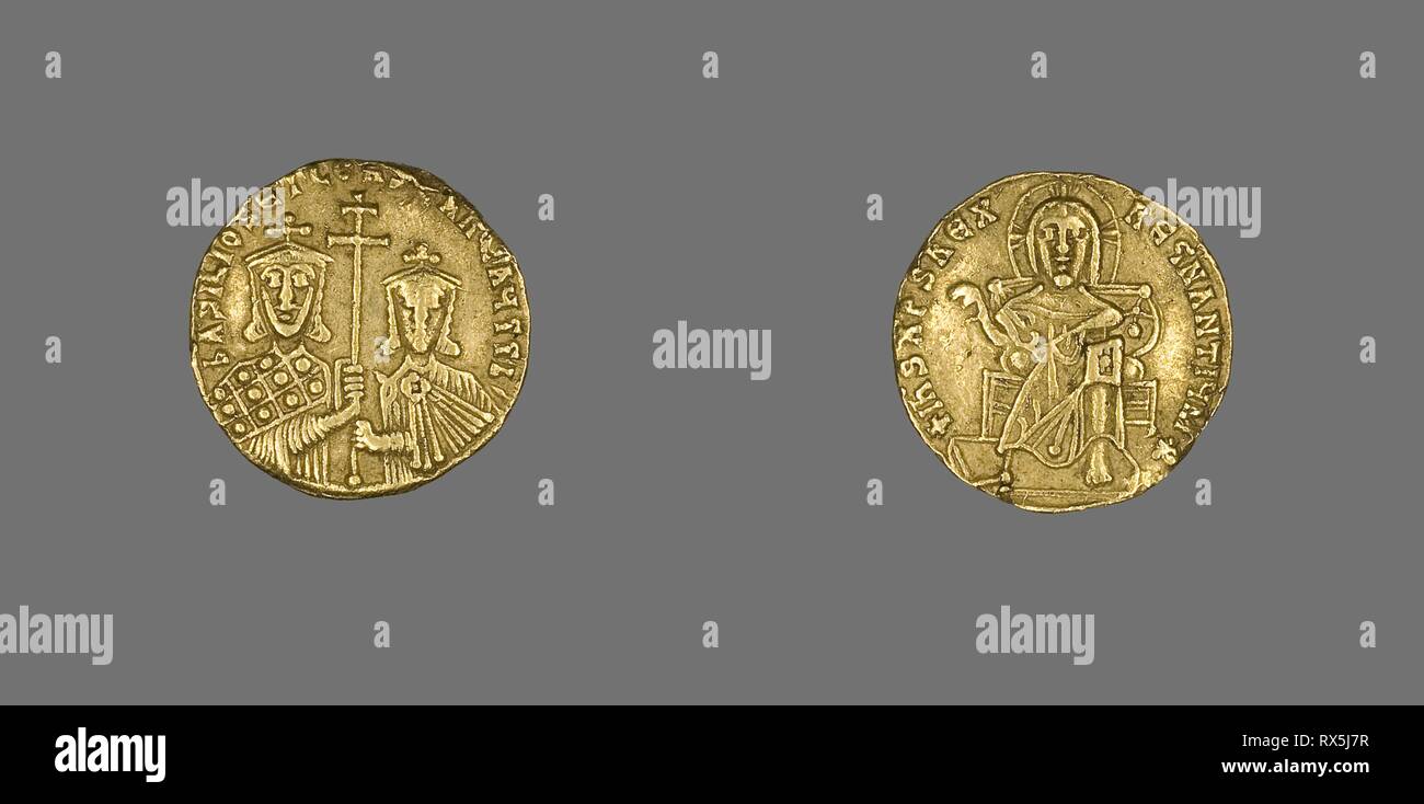 Solidus (Coin) of Basil I with Christ Enthroned. Byzantine, minted in Constantinople. Date: 868 AD-870 AD. Dimensions: Diam. 2 cm; 4.37 g. Gold. Origin: Byzantine Empire. Museum: The Chicago Art Institute. Stock Photo