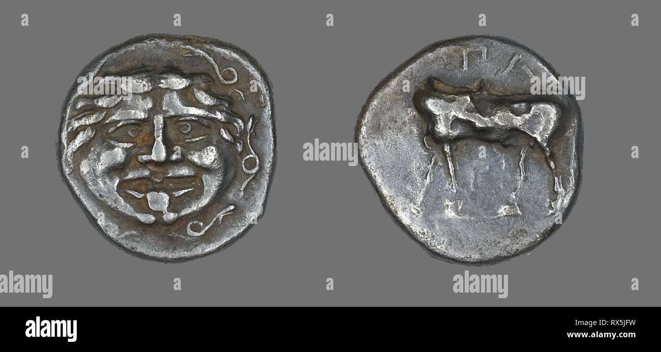 Hemidrachm (Coin) Depicting a Gorgoneion. Greek, minted in Parium, Mysia. Date: 400 BC. Dimensions: Diam. 1.4 cm; 2.28 g. Silver. Origin: Ancient Greece. Museum: The Chicago Art Institute. Stock Photo