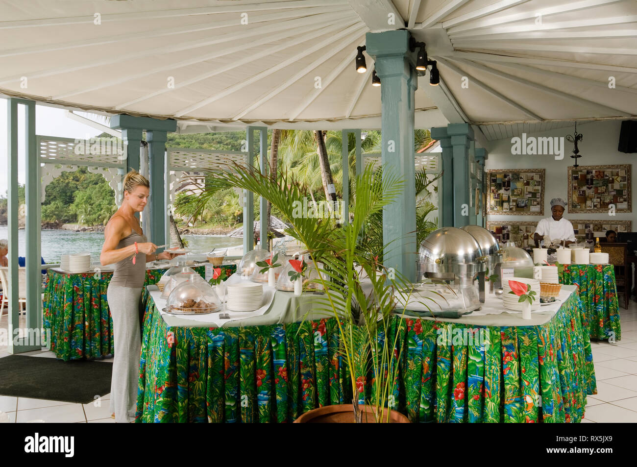Tourist serving herself from hotel buffet Stock Photo