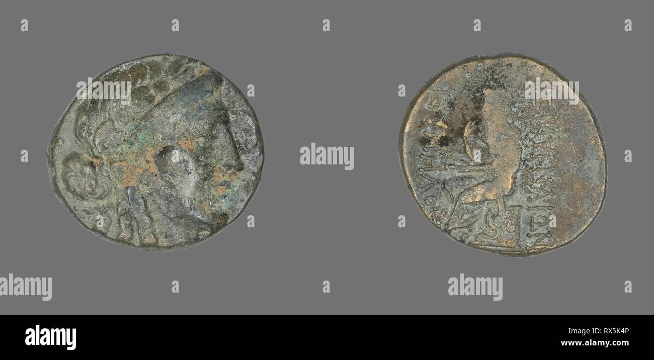 Coin Depicting the God Apollo. Greek. Date: 200 BC-1 BC. Dimensions: Diam. 2 cm; 6.69 g. Bronze. Origin: Ancient Greece. Museum: The Chicago Art Institute. Stock Photo