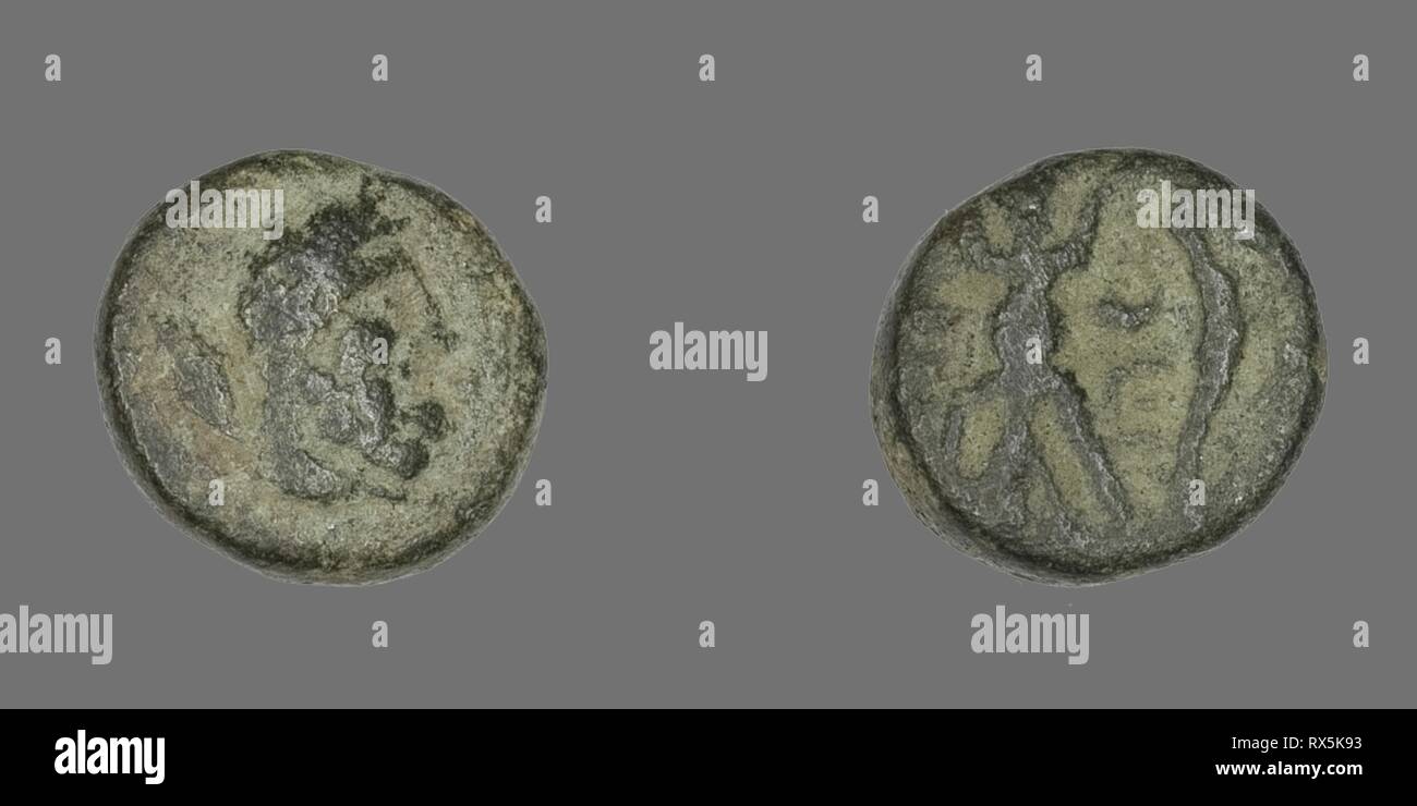 Coin Depicting the Hero Herakles. Greek. Date: 200 BC-1 BC. Dimensions: Diam. 1.2 cm; 2.39 g. Bronze. Origin: Ancient Greece. Museum: The Chicago Art Institute. Stock Photo