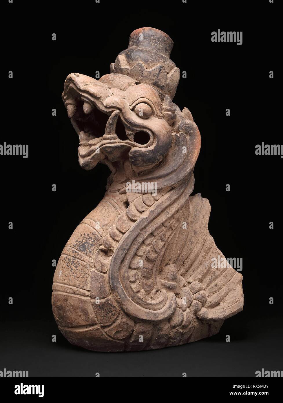 Dragon-Shaped Architectural Ornament. Indonesia; Eastern Java. Date: 1201-1400. Dimensions: 53.1 × 27.2 × 29.1 cm (21 × 10 3/4 × 11 1/2 in.). Terracotta. Origin: Eastern Java. Museum: The Chicago Art Institute. Stock Photo