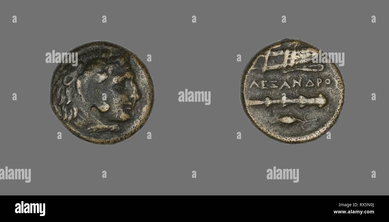 Coin Depicting the Hero Herakles. Greek. Date: 336 BC-323 BC. Dimensions: Diam. 1.7 cm; 6.09 g. Bronze. Origin: Ancient Greece. Museum: The Chicago Art Institute. Stock Photo