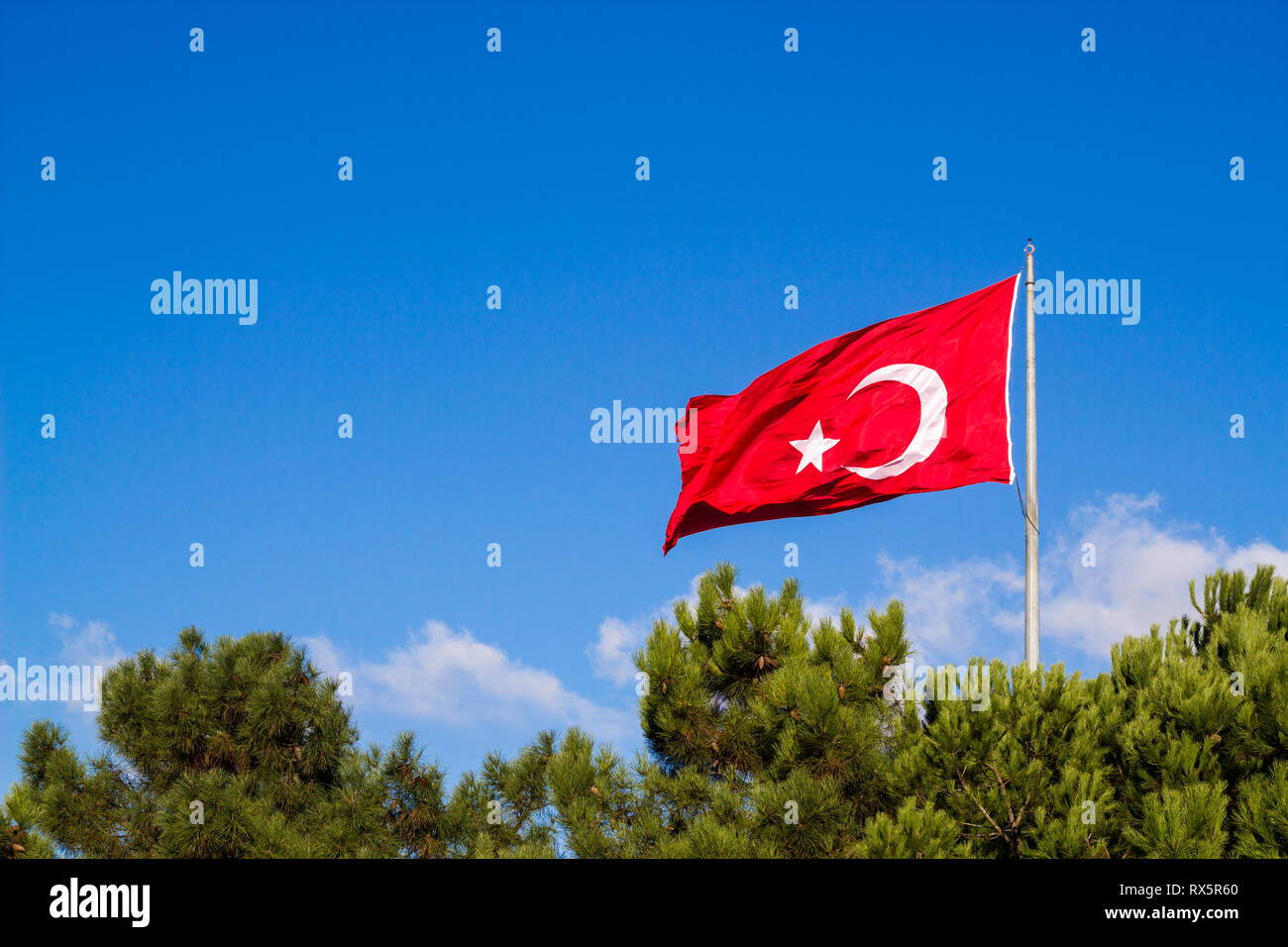 Turkish flag waving in the blue sky Stock Photo Alamy