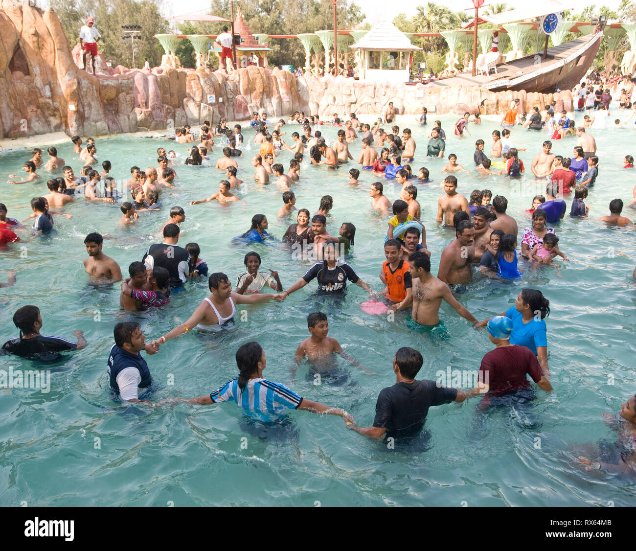 Though there may be water supply issues in the city Water Kingdom part of Essel world amusement park in Gorai, Mumbai, India is undiminished and attracted large crowds over the long weekend.     Water Kingdom is said to be Asia's largest theme water park and has several attractions including the world's biggest wave pool, heart stopping rides 'n' slides, river adventure cruises etc     Attractions of Water Kingdom:   The Wet Atlantic-The world's biggest wavepool   Misphisly Hill-12 hi-speed thrilling rides   Brat Zone-geysers, button-operated water games, jets for kids   Goofers Lagoon- The pe Stock Photo