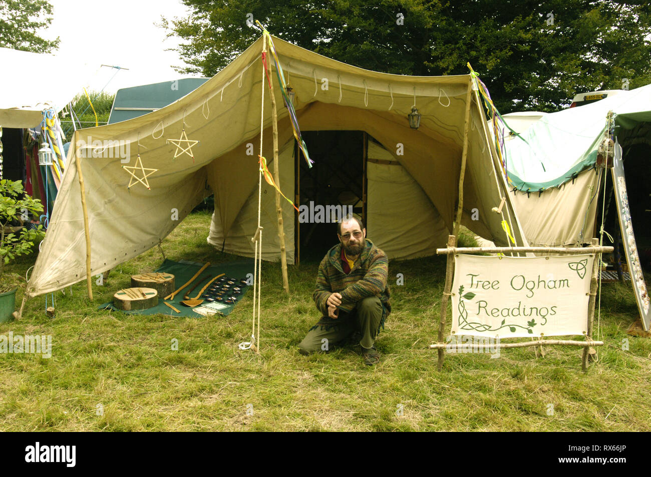 An Environmentally conscious, green fingered Ogham reader, Big Green Gathering, UK August 2005 Stock Photo