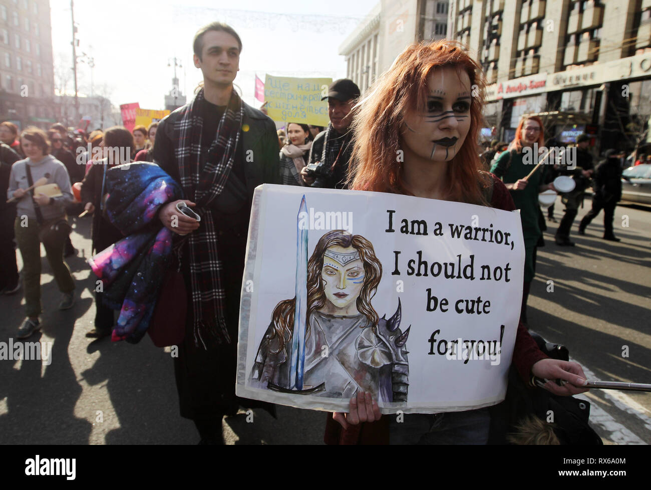 A protester seen holding a placard saying I am a warrior, i should not be cute for you during the protest. Ukrainian feminists and their supporters held their march demanding for rights of women worldwide and against domestic violence during The International Women's Day which is celebrated annually on March 8. Stock Photo