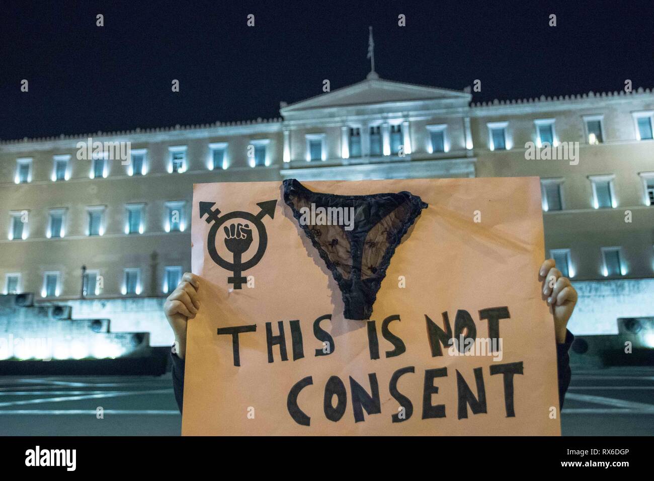 Athens, Greece. 8th Mar, 2019. A protester seen holding a placard with a knicker on it during the demonstration.Hundreds of women participated in the demonstration of ''anti-sexism and patriarchy'' during the international women's day. Credit: SOPA Images/ZUMA Wire/Alamy Live News Stock Photo