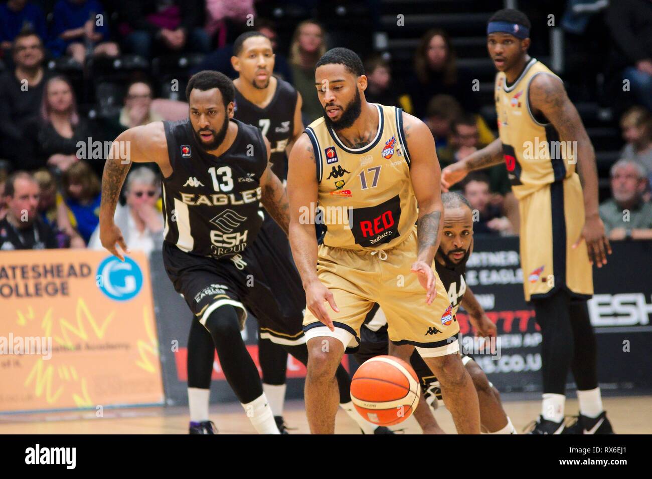 Newcastle upon Tyne, UK.  08 March 2019. Greg Pryor, number 17, playing for Radisson RED Glasgow Rocks against Esh Group Eagles Newcastle in the British Basketball League championship match at the Eagles Community Arena in Newcastle upon Tyne. Darius Defoe is the Newcastle player chasing him. Credit: Colin Edwards/Alamy Live News. Stock Photo