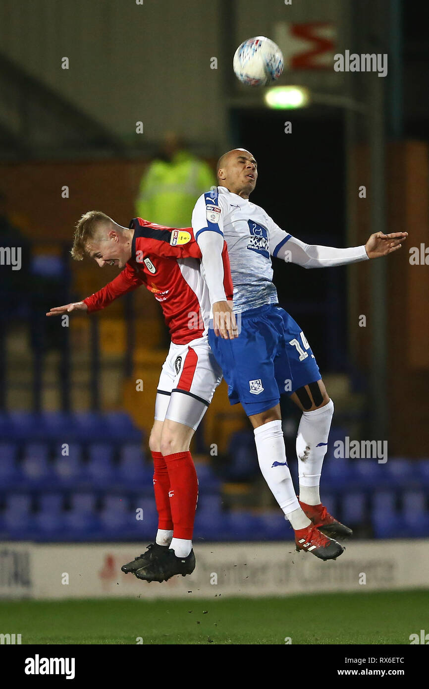 Birkenhead, UK. 08th Mar, 2019. Charlie Kirk of Crewe Alexandra (l) and Jake Caprice of Tranmere Rovers jump for the ball. EFL Skybet Football league two match, Tranmere Rovers v Crewe Alexandra at Prenton Park, Birkenhead, Wirral on Friday 8th March 2019. this image may only be used for Editorial purposes. Editorial use only, license required for commercial use. No use in betting, games or a single club/league/player publications.pic by Chris Stading/Andrew Orchard sports photography/Alamy Live News Credit: Andrew Orchard sports photography/Alamy Live News Stock Photo