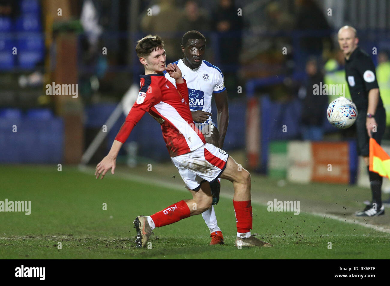 Birkenhead, UK. 08th Mar, 2019. Zoumana Bakayogo of Tranmere Rovers knocks the ball past Callum Ainley of Crewe Alexandra. EFL Skybet Football league two match, Tranmere Rovers v Crewe Alexandra at Prenton Park, Birkenhead, Wirral on Friday 8th March 2019. this image may only be used for Editorial purposes. Editorial use only, license required for commercial use. No use in betting, games or a single club/league/player publications.pic by Chris Stading/Andrew Orchard sports photography/Alamy Live News Credit: Andrew Orchard sports photography/Alamy Live News Stock Photo